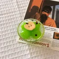 Detail view of a creative green plum fruit fridge magnet with apple slice decoration. - Ice Cold Apple Glass Bowl