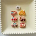 Detailed view of colorful resin cartoon vehicle charms on a decorative ceramic plate. - Without Header Card / Magnetic Set / Set of 6