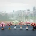 Set of six colorful miniature artificial cherry blossom trees displayed on a car dashboard - Set of 6 / Multicolor (6 Styles Mixed)