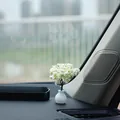 Miniature faux white flower tree in a ribbed vase for car dashboard decoration detail - Pear Tree