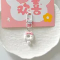 Close-up of a cute pink and white cat shaped donut keychain pendant for girls' school bags - White Pink Cat