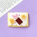 Macro view of a simulation cream biscuit accessory with colorful moon and stars - 4.3cm * 3.0cm / Yellow