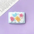 Detailed macro view of a cute DIY resin charm with moon, star, and cream biscuit design - 4.3cm * 3.0cm / Blue