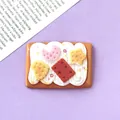 Detail macro shot of cute 3D resin star and moon cream biscuit food play accessory - 4.3cm * 3.0cm / Brown