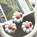 Close-up macro view of white resin daisy flowers with tiny ladybug accents for DIY crafts - Daisy with Ladybug / 3 Pieces/Pack Large / White