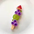 Detailed view of colorful simulated fruit skewer resin accessory for DIY phone case crafts - Double Blueberry Skewer