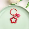 Vibrant red hollow star keychain featuring a small pink star charm for bags and keys - Solid Hollow Star and Jelly Star / 3cm Ring / Red