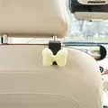 Adorable car headrest hook featuring a yellow bubble bow for back seat storage. - Yellow Bowknot (Black Hook)