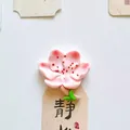 Detailed macro view of a pink cherry blossom fridge magnet with a creative floral design - Blooming Flower with Branch / 5.3x5.2cm