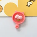 Close-up of pink peach resin flatback charm for DIY crafts and accessories - Peach Plate
