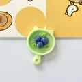 Detailed macro shot of a cute resin blueberry pan charm for DIY crafts and hair clips - Blueberry Plate