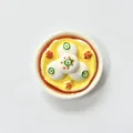 Draufsicht-Nahaufnahme eines 3D-Kühlschrankmagneten in Form von Klebreisbällchen - Fischbällchen Eigelb Stil