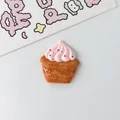 Close-up view of DIY resin cupcake charm for strawberry cream bread accessory decoration - Pink Cake
