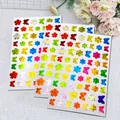 Gedetailleerd overzicht van kleurrijke holografische vlinder- en bloemstickers met glinstering - Holografische Laser Vlinder Bloem (A227)