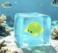 Detailed view of a translucent blue squishy cube with a cute green octopus toy inside. - 5.5cm Cube / OPP Packaging / Luminous Crab