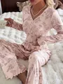 Detail of pink ribbed floral pajama set with long sleeves and ruffled cuffs for women - S / Top And Bottom / Light Pink Floral