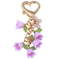 Elegante portachiavi con fiori viola, chiusura a cuore dorata e ciondolo farfalla - Mughetto Viola