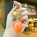 Creative realistic orange lemon fruit keychain charm with gold hardware and green leaf detail - Lemon / 1 Piece / Orange
