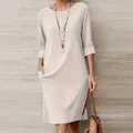 Robe midi élégante beige à col rond avec poches latérales et manches mi-longues - Blanc Cassé