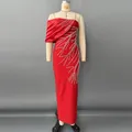 Detailed view of the sparkling rhinestone patterns on an elegant red bandage evening gown - S / Dresses / Red