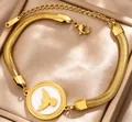 Bracciale in acciaio al titanio placcato oro 18K con pendente a uccello e doppia catena - Gold b-42g / Oro 18K
