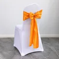 Vibrant orange satin chair bow with white stretch chair cover for wedding banquets - Orange