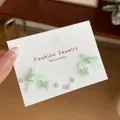Sweet mint green fabric bow and butterfly pearl stud earring set presented on display card - Light Green Bow Ribbon (3 Pairs)
