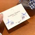 Sweet fabric bow and purple zircon pearl earring set on a display card - Royal Blue Bow Ribbon (3 Pairs)