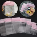 Detailed view of clear pink zip-lock jewelry bags in six different sizes for small accessories - Pink Header / 4*6cm