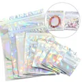 Close-up of holographic resealable bags in various sizes for stylish jewelry packaging - 6*8cm / Foil Laser