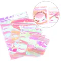 Close-up detail of iridescent holographic ziplock bags for jewelry packaging and storage. - Rainbow Laser / 4*6cm