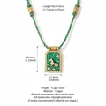 Groene emaille Steenbok sterrenbeeld ketting met vergulde hanger en gevlochten koord. - Steenbok