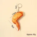 Realistic fried chicken wing model keychain showing dimensions and 43g weight specification - Grilled chicken wings-keychain