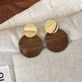 Retro wooden geometric stud earrings featuring elegant gold and brown circle design - Wavy Round Disc (28500A)