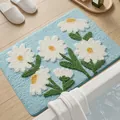 Tappetino da bagno azzurro con motivo a margherite bianche e morbida texture felpata casa - Margherita rivolta al sole