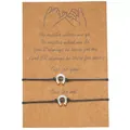 Set of two stainless steel horseshoe charm woven rope bracelets on a brown gift card - Horseshoe Style / Set of 2 / Black + Silver