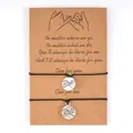 Detailed view of handmade pinky swear friendship bracelets on a kraft card set of two - Pinky Swear Style / Set of 2 / Black