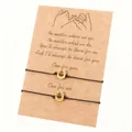 Handmade friendship bracelet set with golden horseshoe charms on kraft message card - Horseshoe Style / Set of 2 / Black + Gold