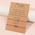 Handmade red wax rope friendship bracelets with silver horseshoe charms on display card - Horseshoe Style / Set of 2 / Red + Silver