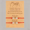 Pair of red wax cord friendship bracelets with silver barbell charms on kraft card. - Dumbbell Style / Set of 2 / Red + Silver