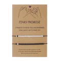 Pair of adjustable black and white beaded promise bracelets on brown kraft paper card - Black and White Beads (ZJ11537) / Set of 2