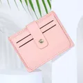 Cute pink PU leather card holder with multiple card slots and a secure snap button closure - Pink