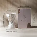 Nordic style white ceramic vase with decorative bow texture and packaging size details - St. Ives - Color Box