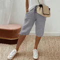 Detail view of grey cotton linen cropped pants showing the drawstring waist and relaxed fit - S / Bottoms / Light Gray