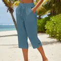 Casual blue wide-leg cropped pants with drawstring waist and pocket details on beach. - S / Bottoms / Orange Red