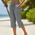 Detailed view of striped summer pants with drawstring and side slits at the beach - S / Bottoms / Black Stripe