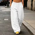Detail view of white high street baggy wide-leg sweatpants with drawstring waistline - S / Bottoms / White