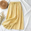Detailed view of vintage yellow checkered cotton linen A-line midi skirt with drawstring. - M / Bottoms / Yellow