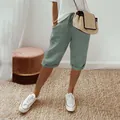 Detail of women's sage green cotton linen cropped pants with drawstring and pockets. - S / Bottoms / Light Green