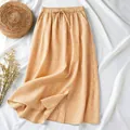 Detailed view of the orange gingham cotton linen midi skirt with a drawstring waist - M / Bottoms / Mint Green